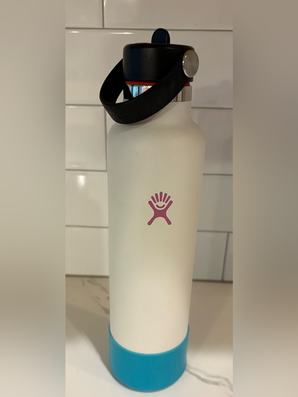 Hydro Flask White Water Bottle with Pink Logo and Blue Base